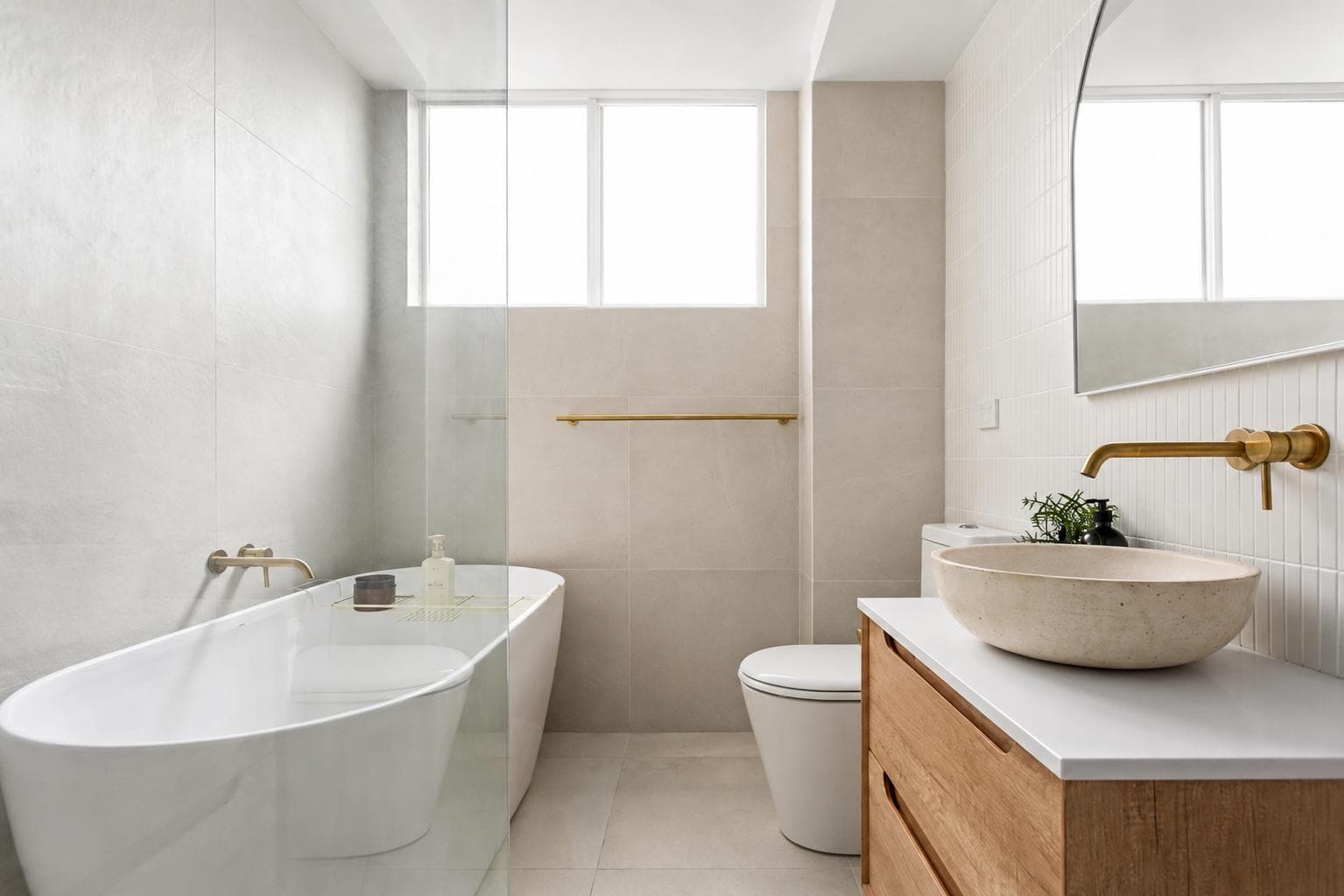 Freestanding bathtub, brass tapware and stone vessel basin, Penkivil St Bondi